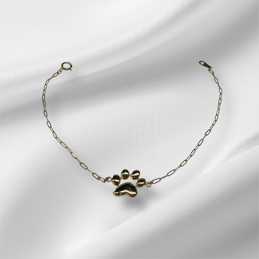 Esclava paperclirp con huella de perrito 7.25” oro 14k