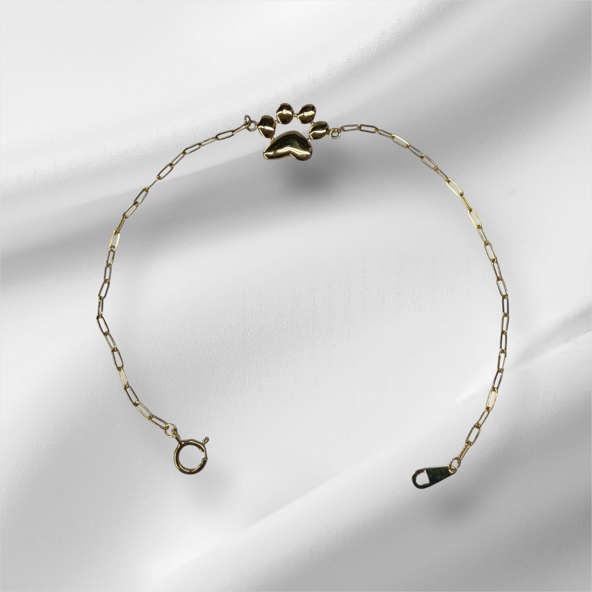 Esclava paperclirp con huella de perrito 7.25” oro 14k