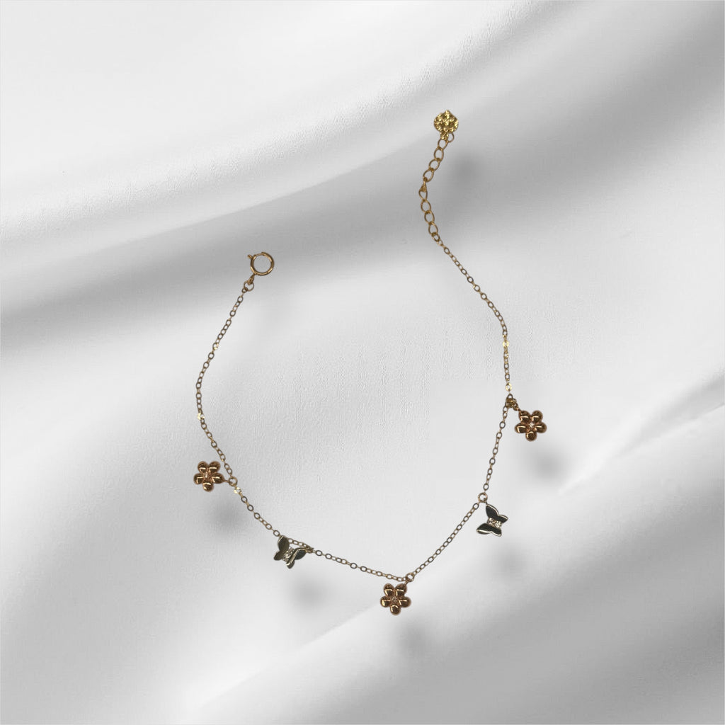 Esclava con mariposas y flores de tres tonos en oro 14k