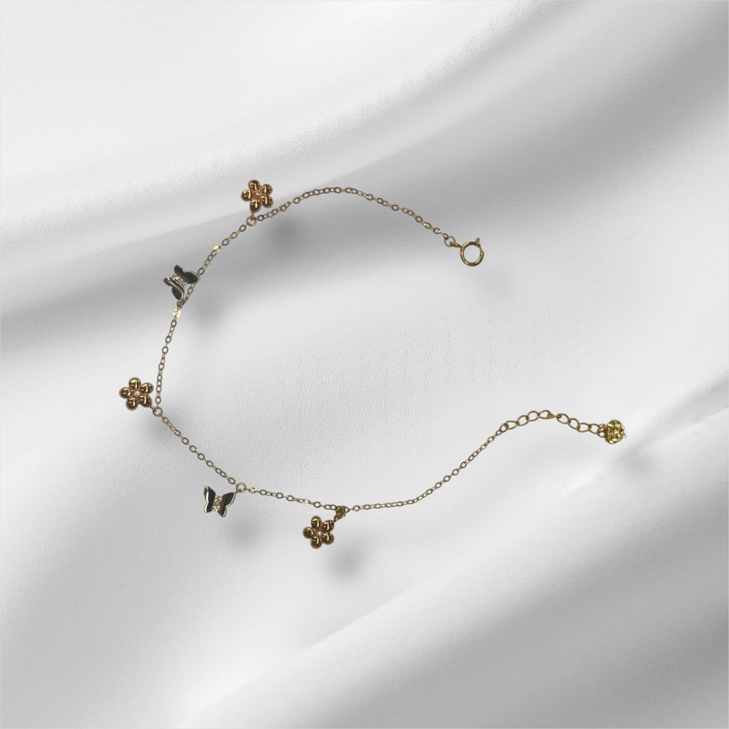 Esclava con mariposas y flores de tres tonos en oro 14k
